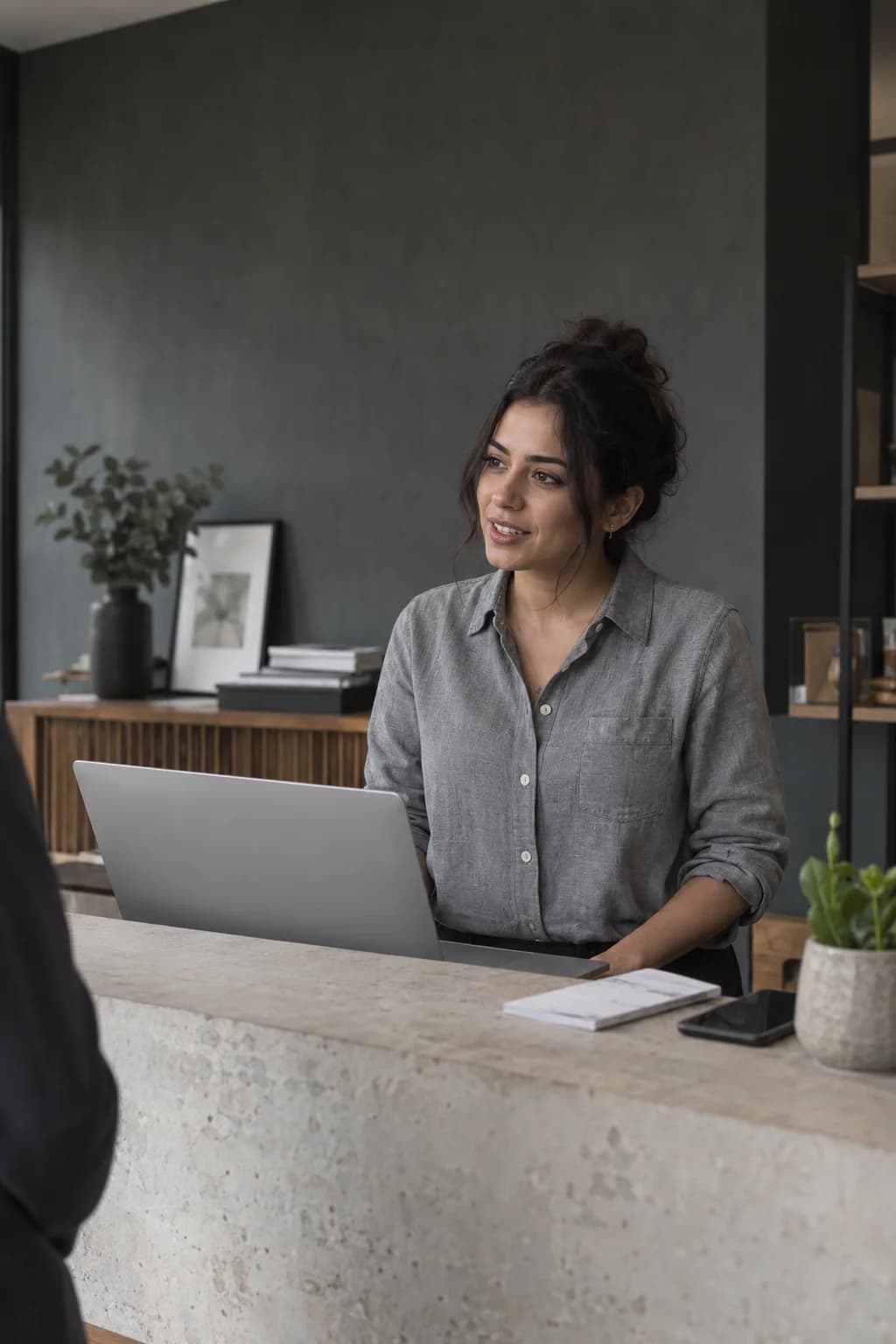 An illustrative business owner at her reception desk